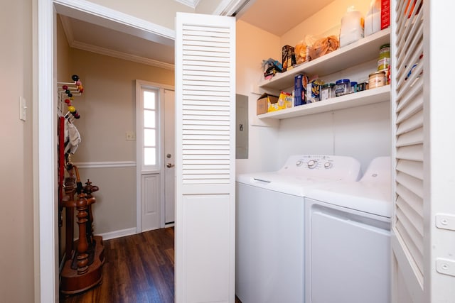 laundry room with dark hardwood / wood-style flooring, washing machine and dryer, and crown molding