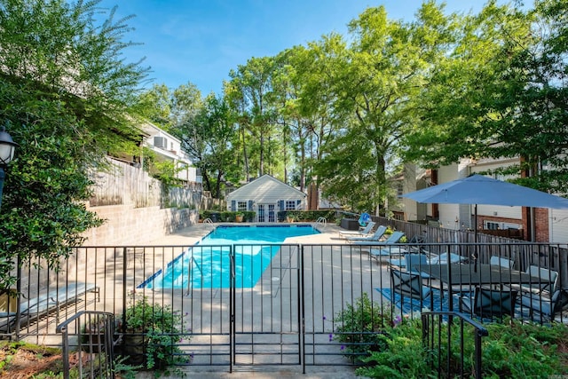 view of swimming pool with a patio