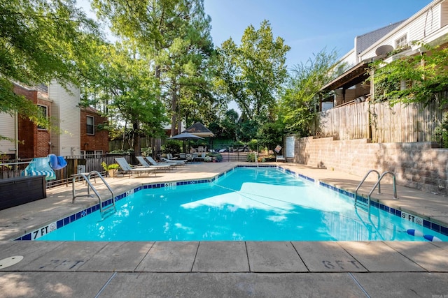 view of pool featuring a patio