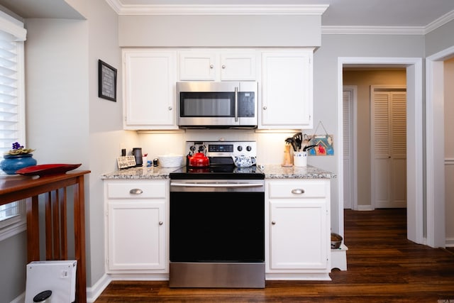 kitchen featuring appliances with stainless steel finishes, ornamental molding, dark hardwood / wood-style floors, and white cabinets