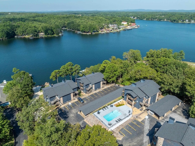 bird's eye view featuring a water view and a wooded view