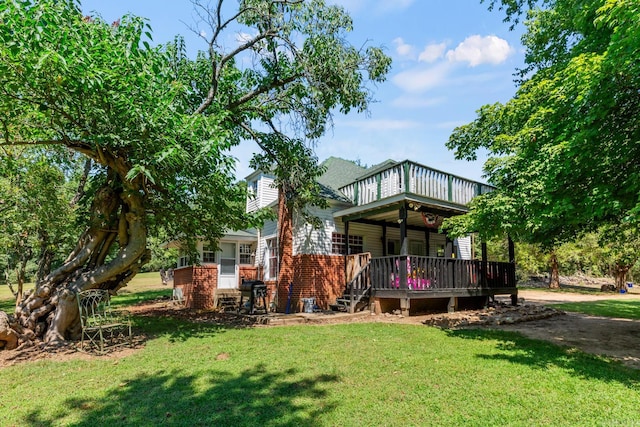 rear view of house with a lawn