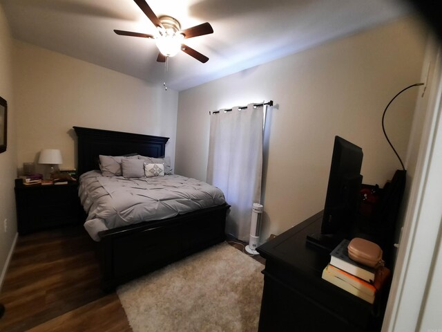 bedroom with ceiling fan and wood-type flooring