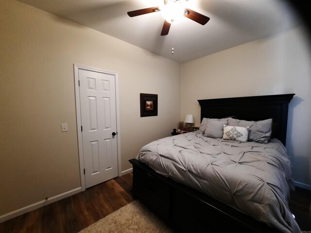 bedroom featuring ceiling fan and dark hardwood / wood-style floors