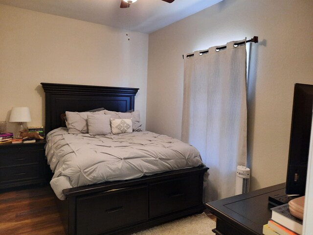 bedroom with ceiling fan and hardwood / wood-style flooring