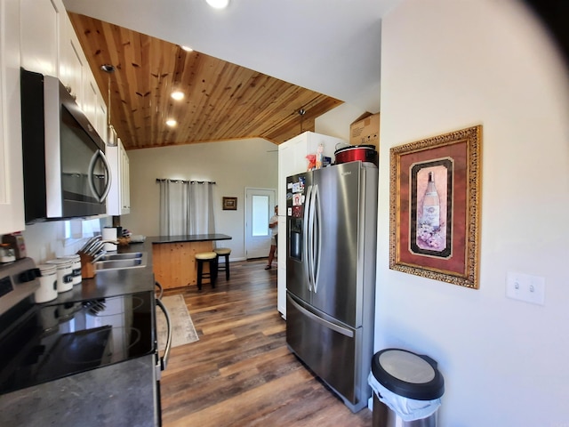 kitchen with sink, wooden ceiling, dark hardwood / wood-style floors, white cabinetry, and stainless steel appliances