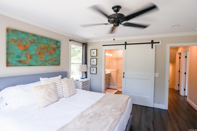 bedroom with ornamental molding, dark hardwood / wood-style flooring, ensuite bath, ceiling fan, and a barn door