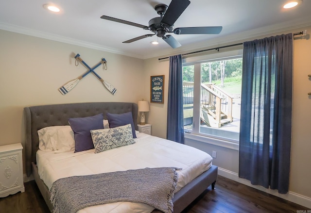 bedroom featuring ceiling fan, dark wood-type flooring, and ornamental molding