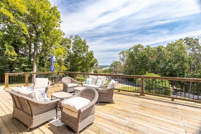 wooden deck featuring outdoor lounge area