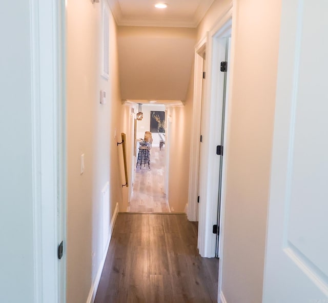 hallway featuring crown molding and wood-type flooring