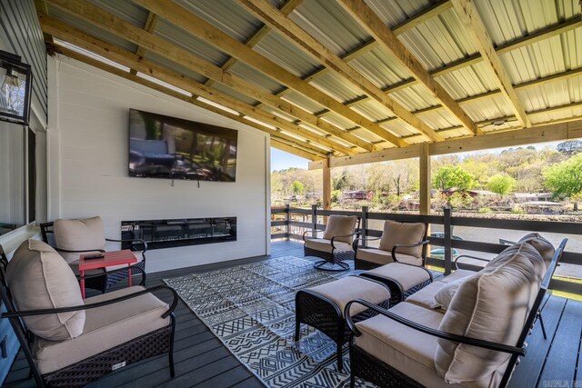 wooden deck featuring an outdoor living space