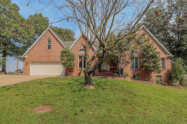 view of front of property with a garage and a front yard