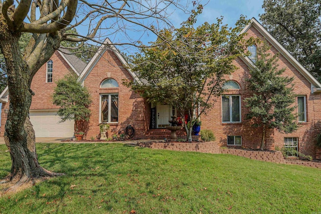 view of front of house featuring a garage and a front yard