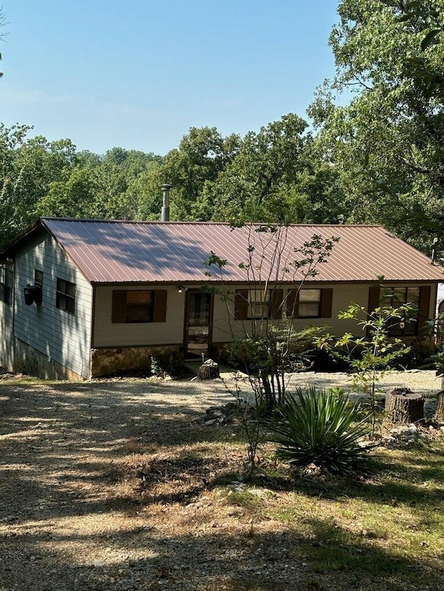 ranch-style house with metal roof