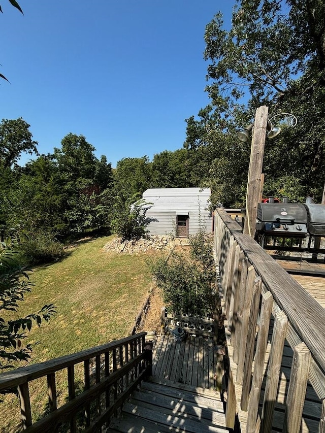 exterior space with a shed and a deck