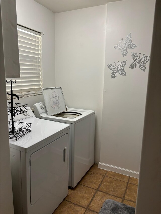 laundry room with separate washer and dryer