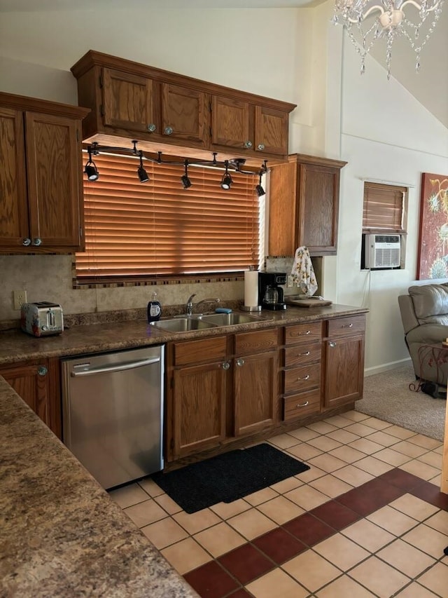 kitchen featuring cooling unit, a notable chandelier, sink, light tile patterned flooring, and stainless steel dishwasher