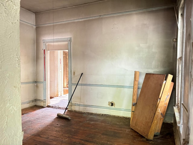 empty room featuring dark hardwood / wood-style flooring