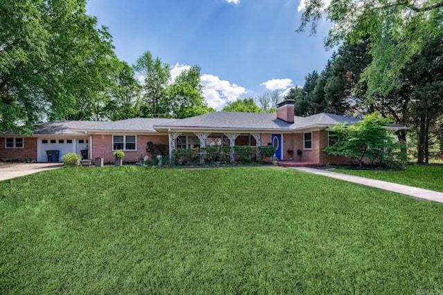 single story home featuring a garage and a front lawn