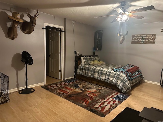 bedroom featuring ceiling fan and light wood-type flooring