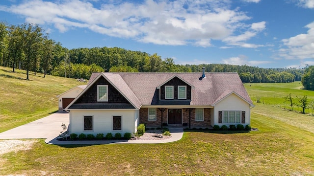 cape cod home featuring a front lawn