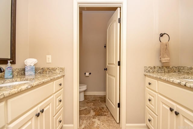 bathroom with tile patterned floors, toilet, and vanity