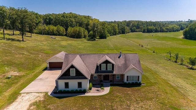 birds eye view of property with a rural view