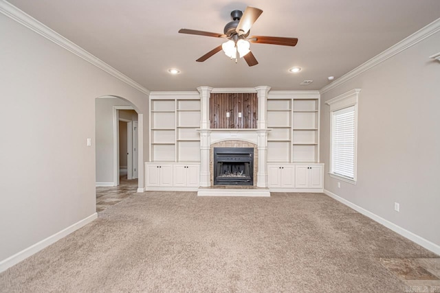 unfurnished living room with crown molding, ceiling fan, and carpet flooring