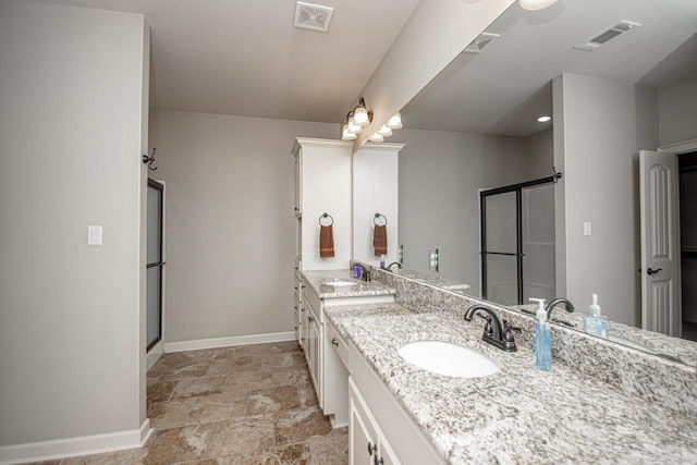 bathroom featuring vanity, walk in shower, and tile patterned floors