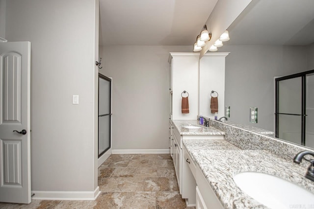 bathroom featuring vanity, walk in shower, and tile patterned flooring