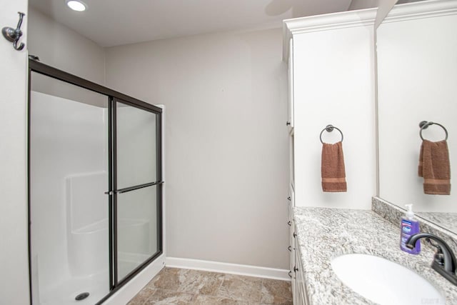 bathroom with vanity, tile patterned flooring, and a shower with door