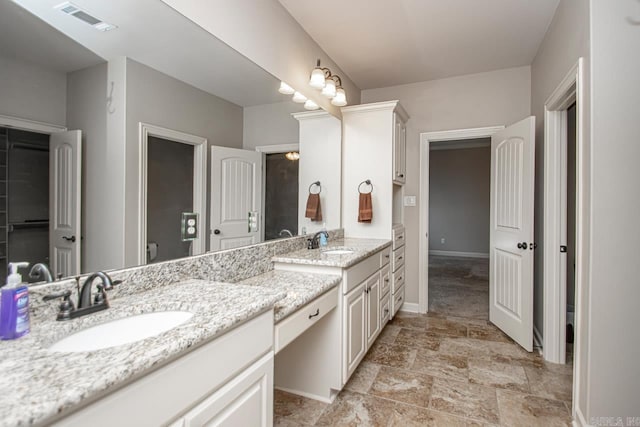 bathroom featuring vanity and tile patterned flooring