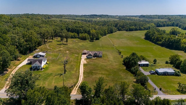 birds eye view of property with a rural view