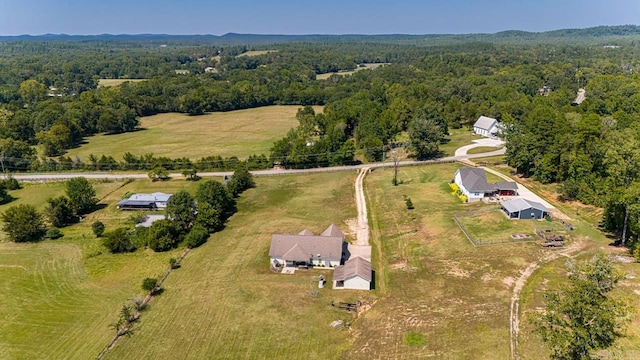 birds eye view of property with a rural view