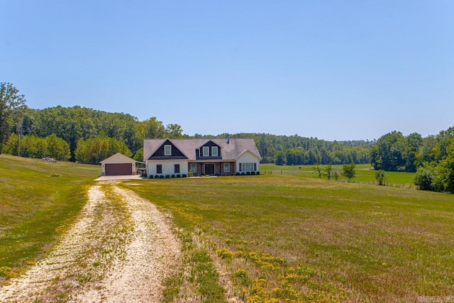 cape cod-style house featuring a rural view