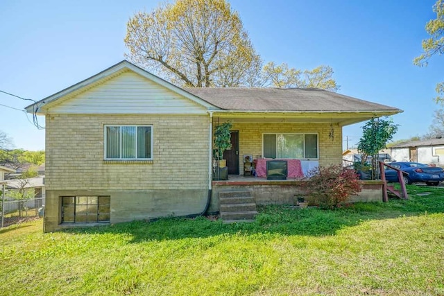 rear view of house with a lawn