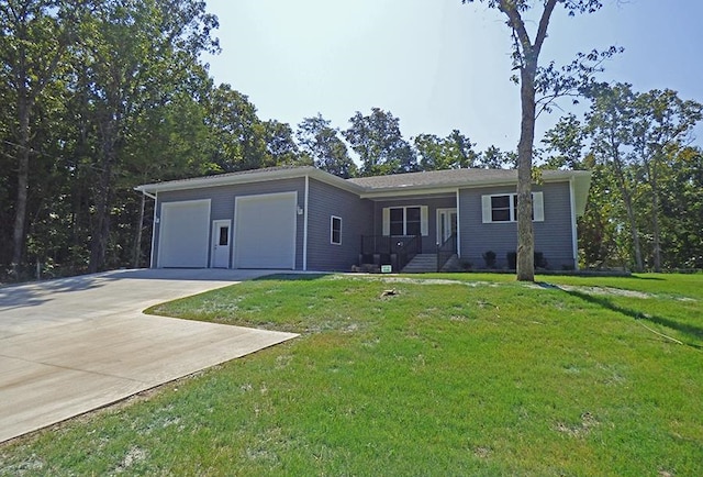 single story home featuring a front yard and a garage