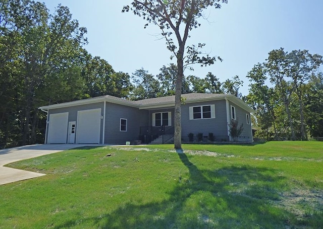 single story home with a front yard and a garage