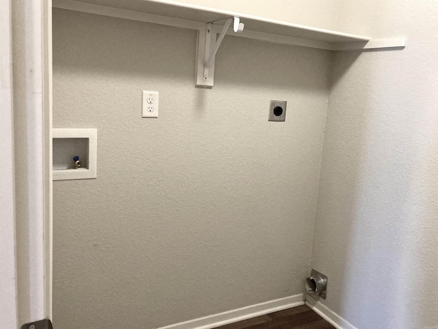 clothes washing area with laundry area, baseboards, dark wood-type flooring, hookup for a washing machine, and hookup for an electric dryer