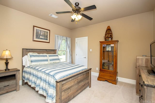 bedroom featuring ceiling fan and carpet