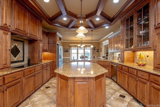 kitchen featuring crown molding, coffered ceiling, kitchen peninsula, pendant lighting, and a kitchen island