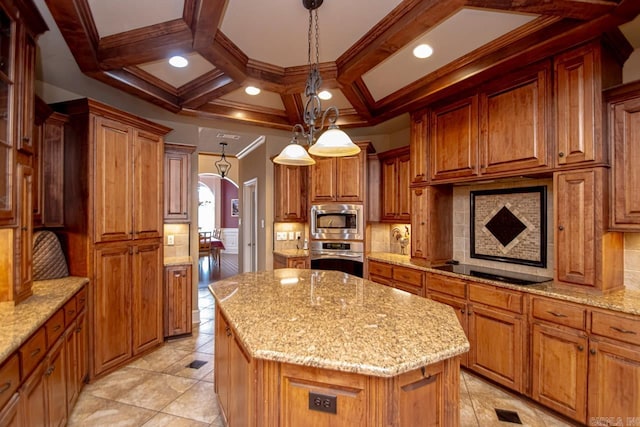 kitchen with a kitchen island, stainless steel appliances, light stone countertops, and decorative light fixtures