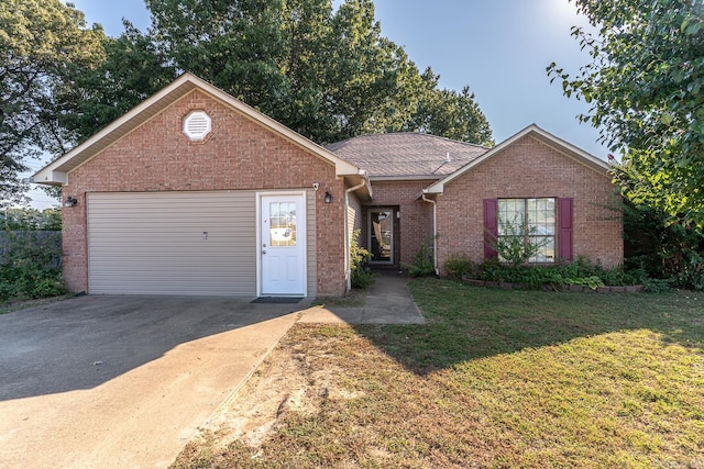 view of front facade with a garage and a front lawn