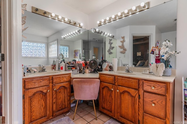 bathroom with tile patterned flooring, vanity, and ensuite bath