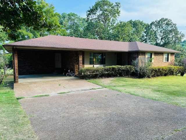 ranch-style home featuring a front yard and a carport