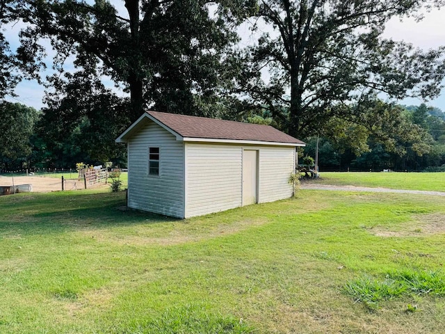 view of outdoor structure featuring a lawn