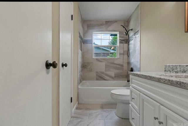 full bathroom featuring tile patterned flooring, vanity, toilet, and tiled shower / bath combo