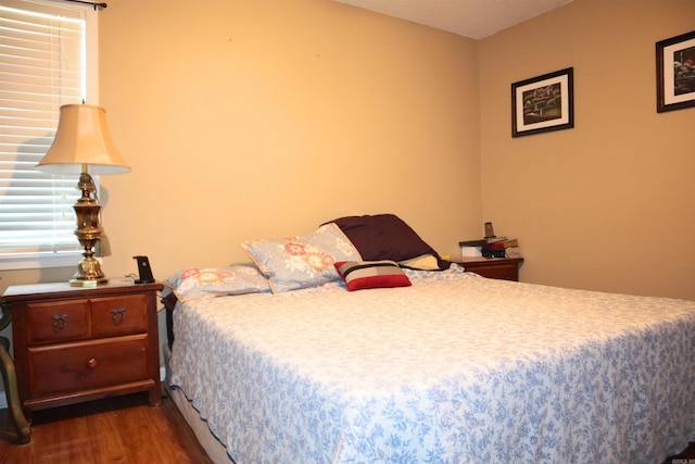 bedroom featuring wood finished floors