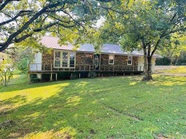 back of house with a yard