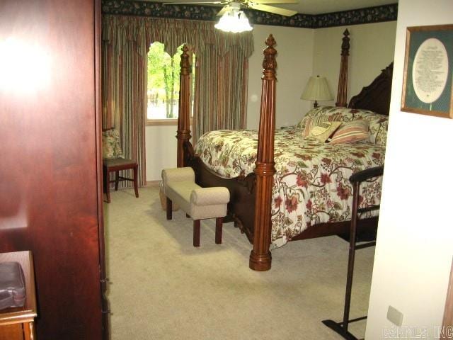 bedroom with ceiling fan and carpet floors